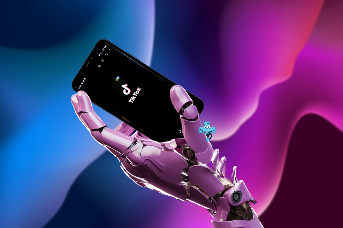 Telefon z aplikacją TikTok trzymany w ręku przez robota